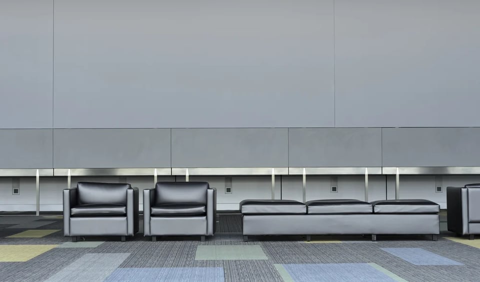 Furniture-with-dark-upholstery-like-leather-in-corridor-of-convention-center