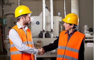 Female-worker-shake-hand-with-male-worker