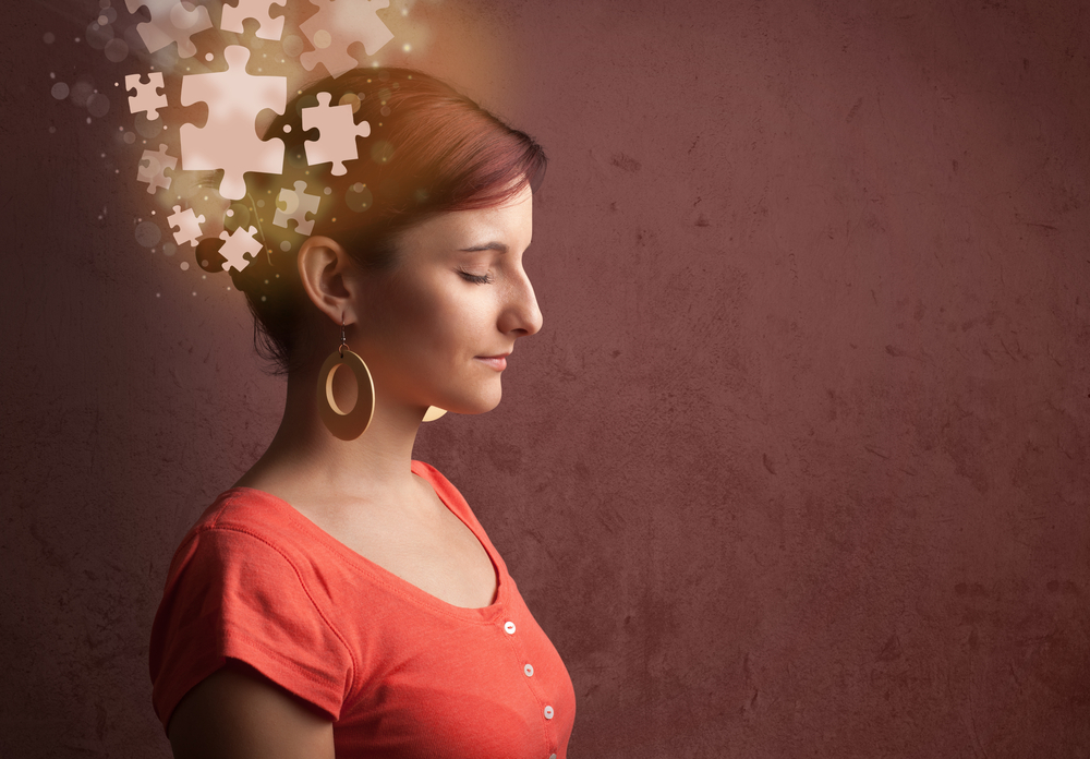 Psychology of a clean office with a young person thinking with glowing puzzle mind on grungy background