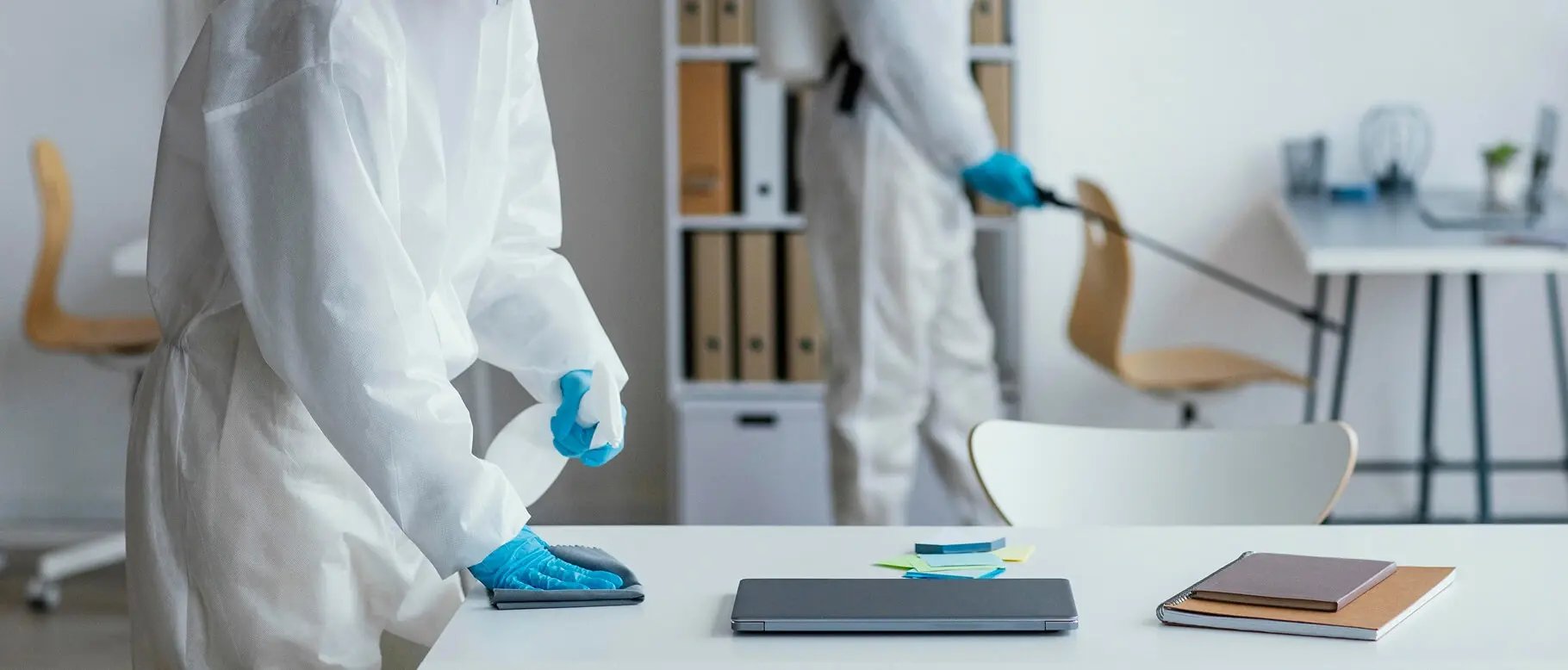 people-disinfecting-biohazard-area